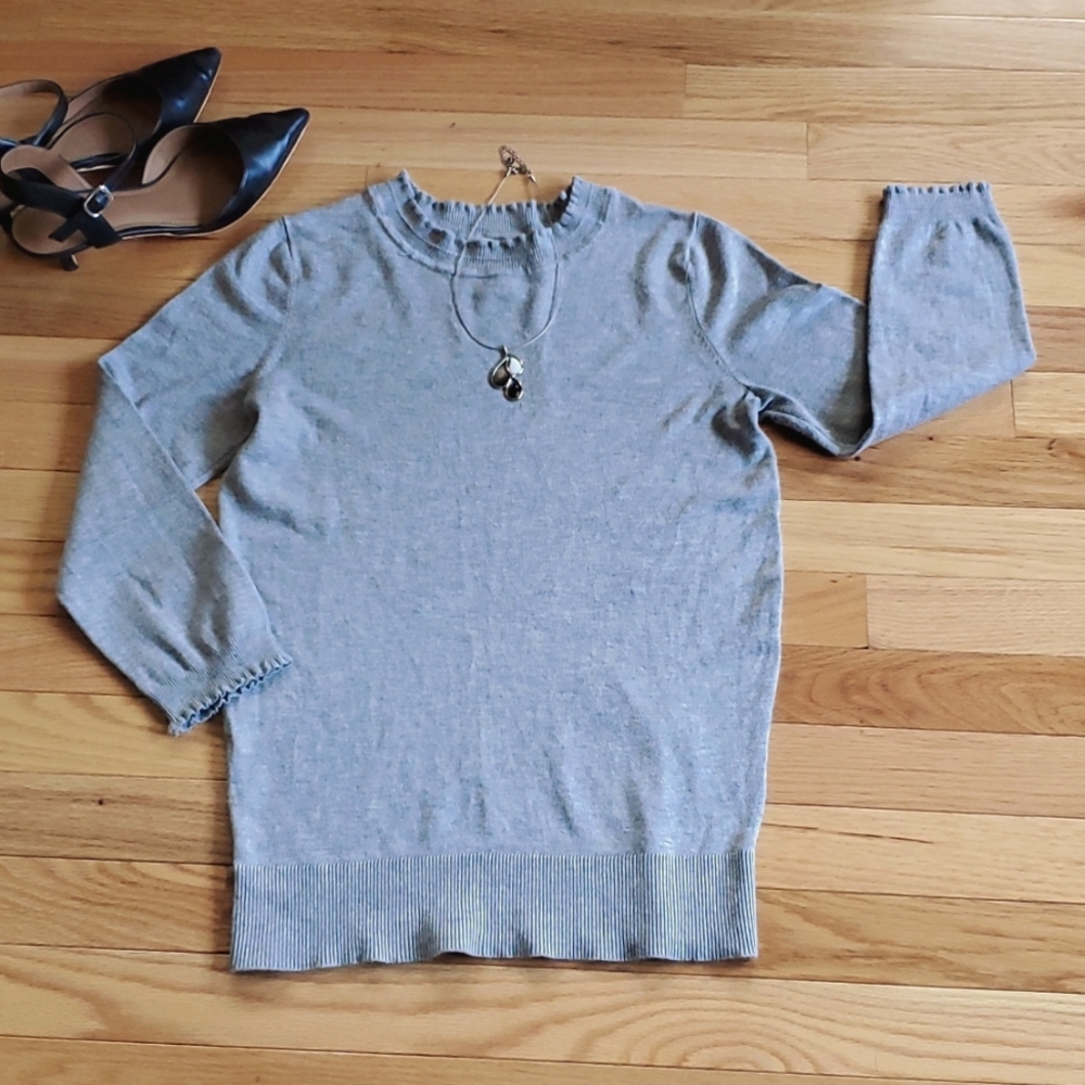 Simple and clean gray sweater with scalloped/ruffled sleeves and collar